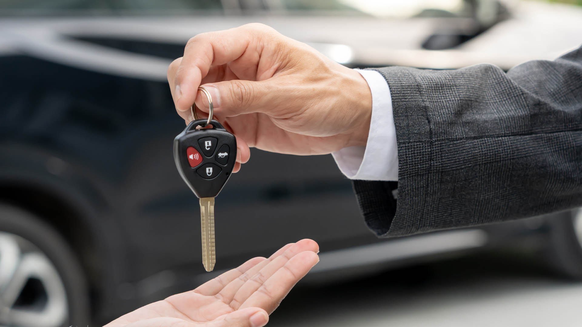 Educational graphic titled "Is it Safe to Buy a Car with a Rebuilt or Salvage Title?" featuring a split image of a shiny car body next to a highlighted view of its underlying frame and airbag systems.