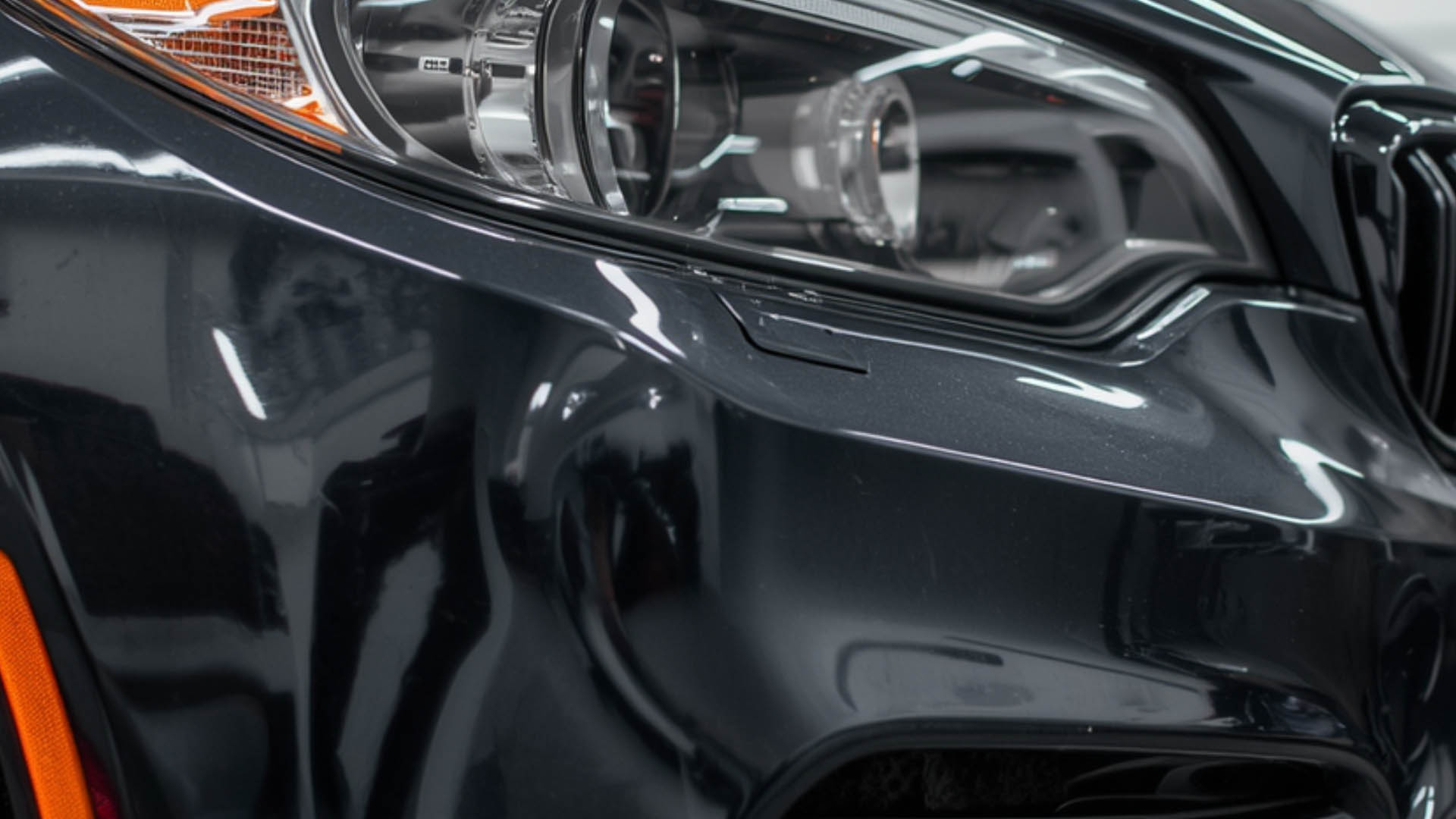 Title graphic reading "Plastic Bumper Repair vs. Replacement: When Can You Safely Save the Part?" featuring a side-by-side comparison of a cracked bumper and a new OEM replacement part.